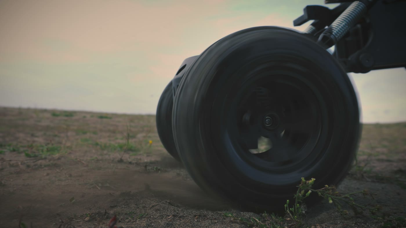 Close detail of the rover drive wheel on open ground